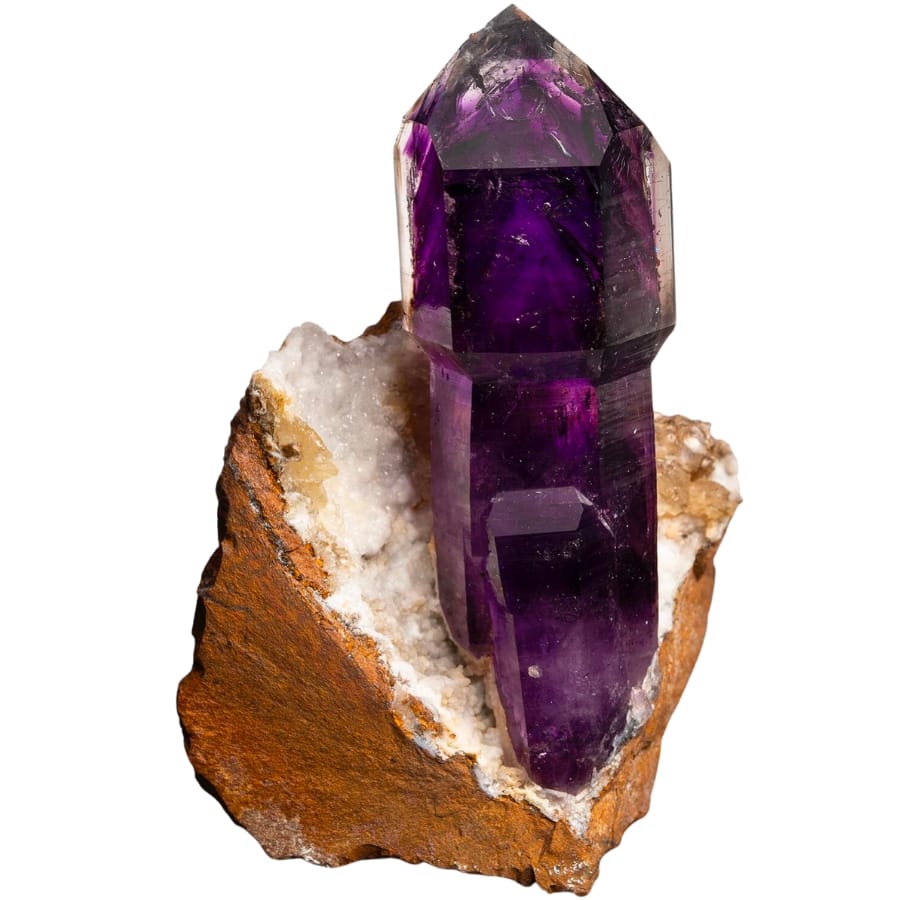 A deep purple amethyst scepter on matrix