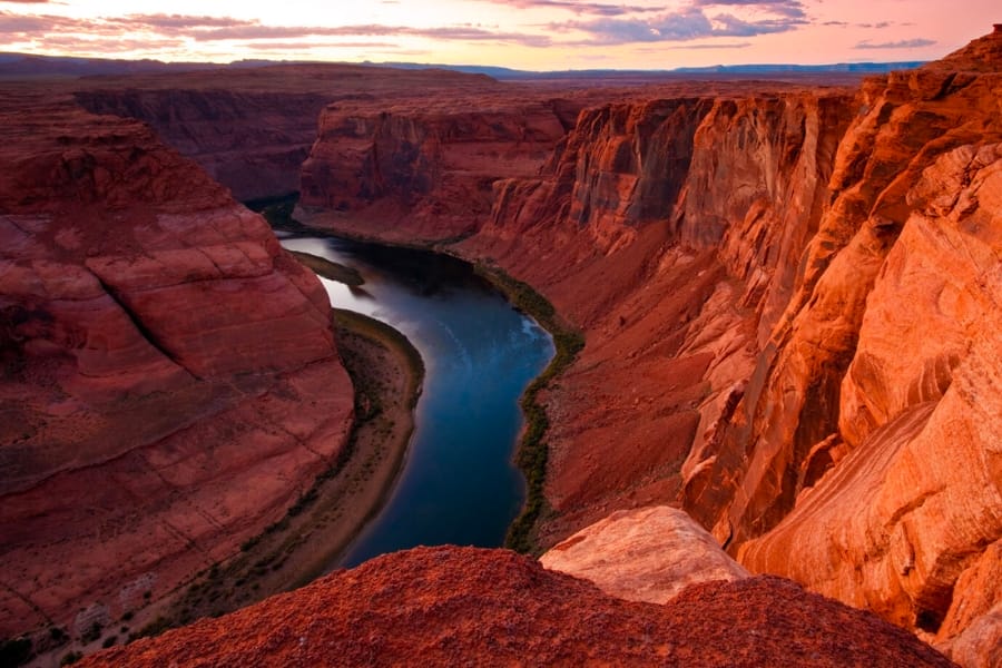 A picturesque view of the Colorado River enveloped by its amazing valley