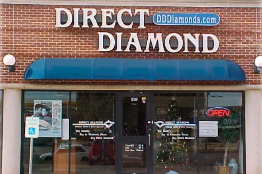 A look at the front store window and signage of Direct Diamond