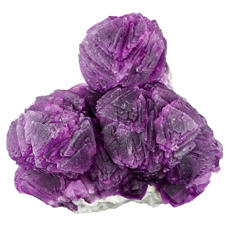 A majestic flower-like formation of a fluorite mineral with its vibrant purple color.