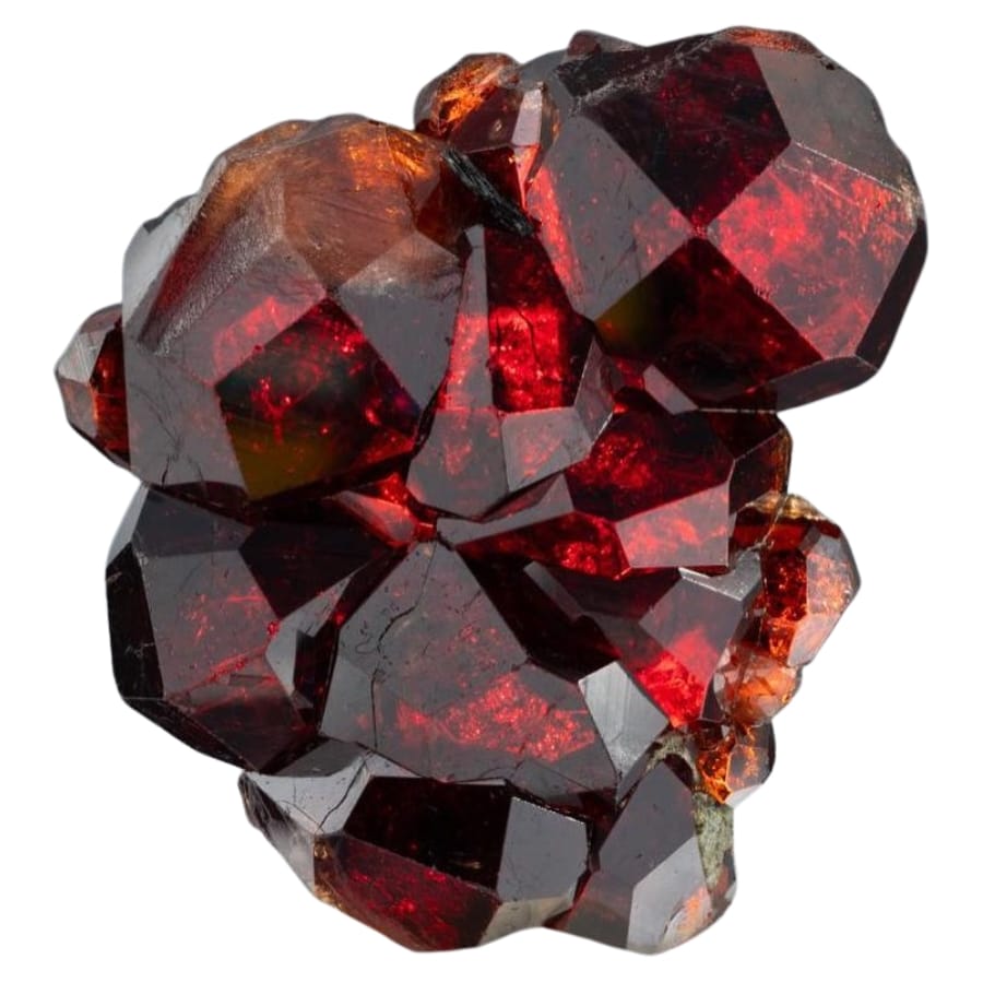 An elegant shiny and glass-like garnet specimen with vibrant red hues