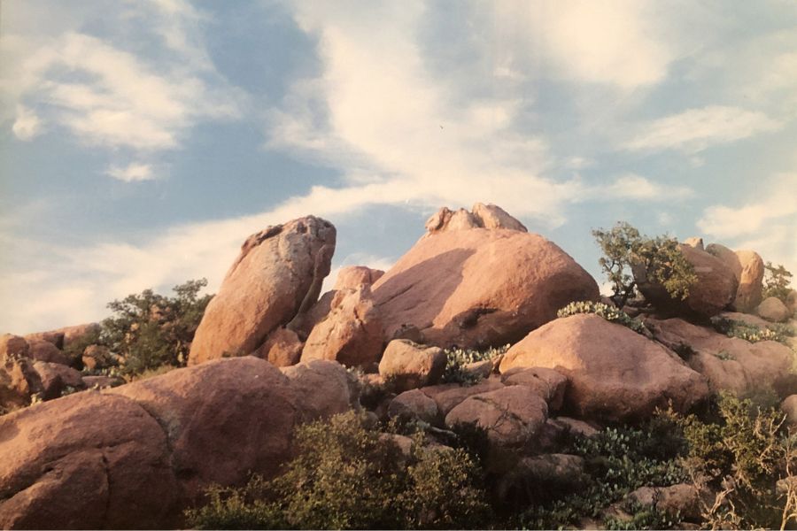 large brown rocks against a blue sky