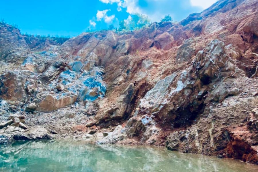 A portion of the Mona Lisa Turquoise Mine with signature vibrant blue hues on the rocks