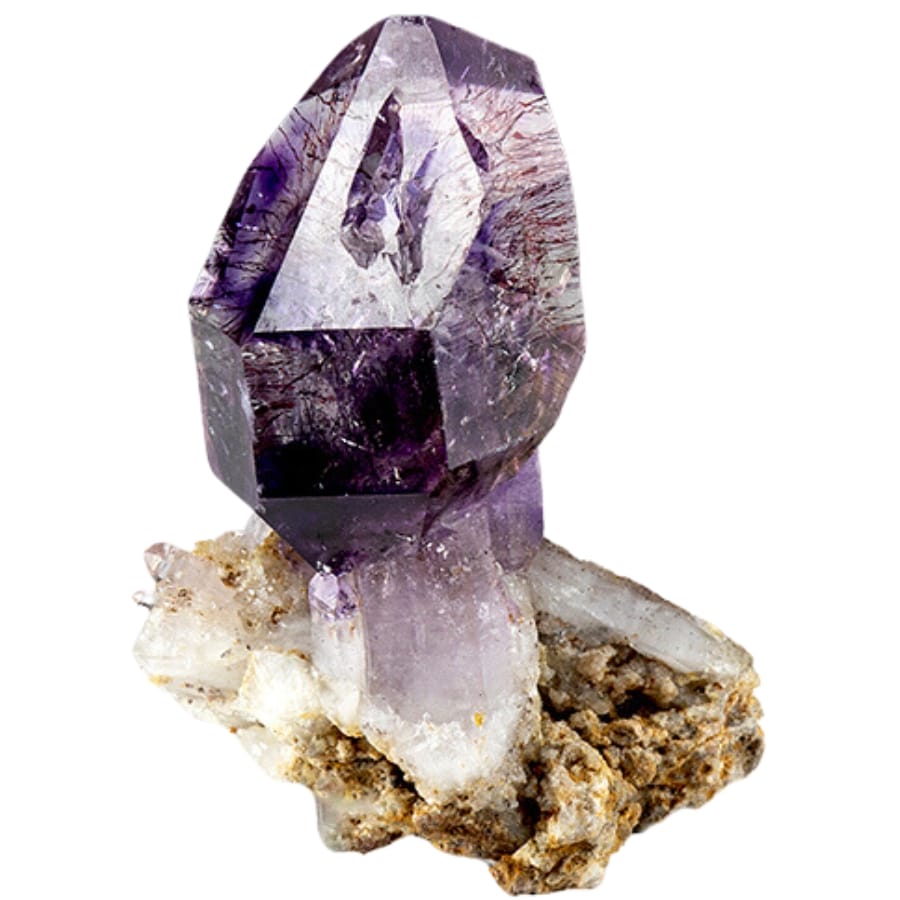 A majestic formation of a raw and natural amethyst crystal on a matrix