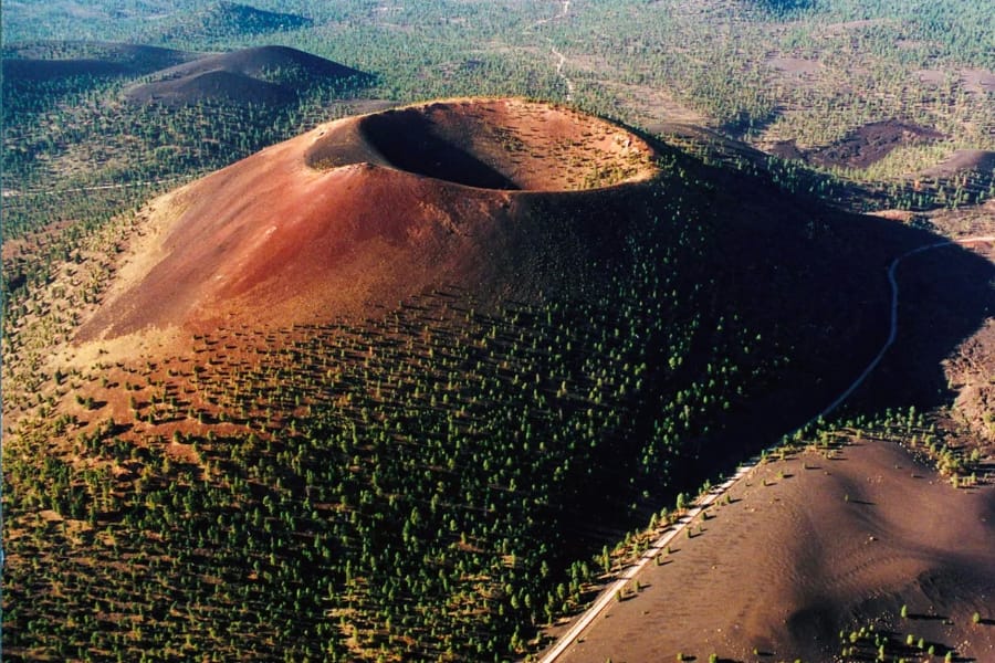 Aerial view of the enormous Sunset Crater and its surrounding sparse trees