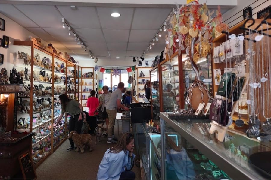 A peak at the showroom and available items at The Rock Shop with a few customers keenly looking at specimens