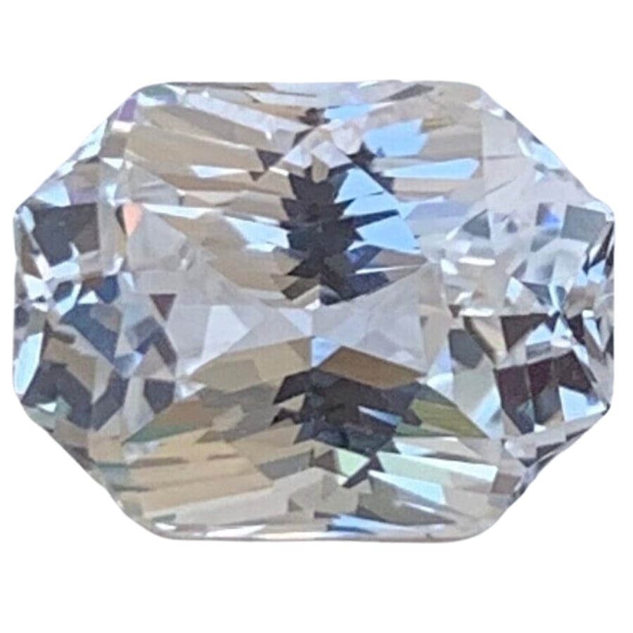 A gorgeous uniquely shaped white sapphire polished gemstone