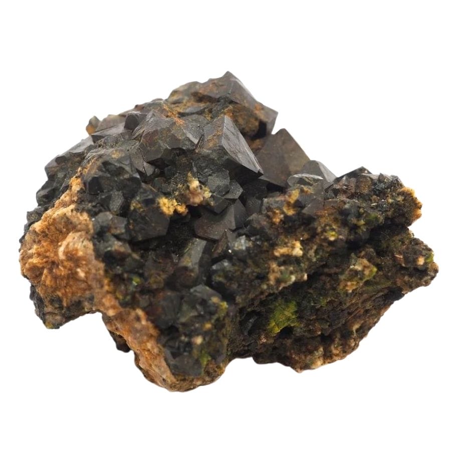 black pyramid-like magnetite crystals on a rock