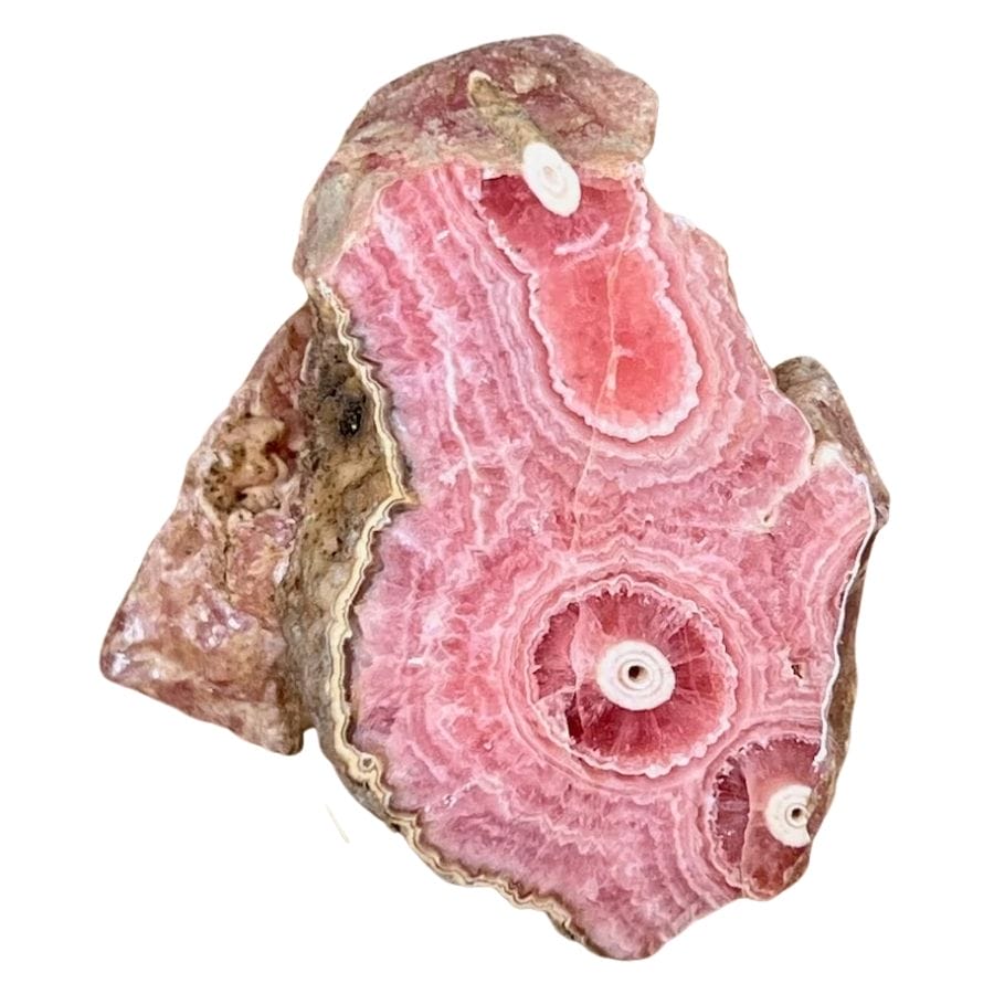 rough rhodochrosite crystal with red, pink, and white bands