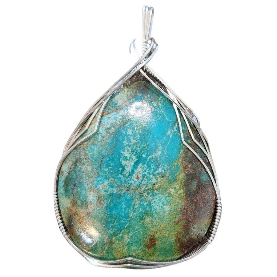 pear-shaped blue turquoise with brown matrix in a silver setting, used as a pendant