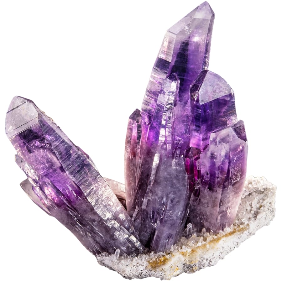 Beautiful amethyst crystals on a white, quartz-covered matrix