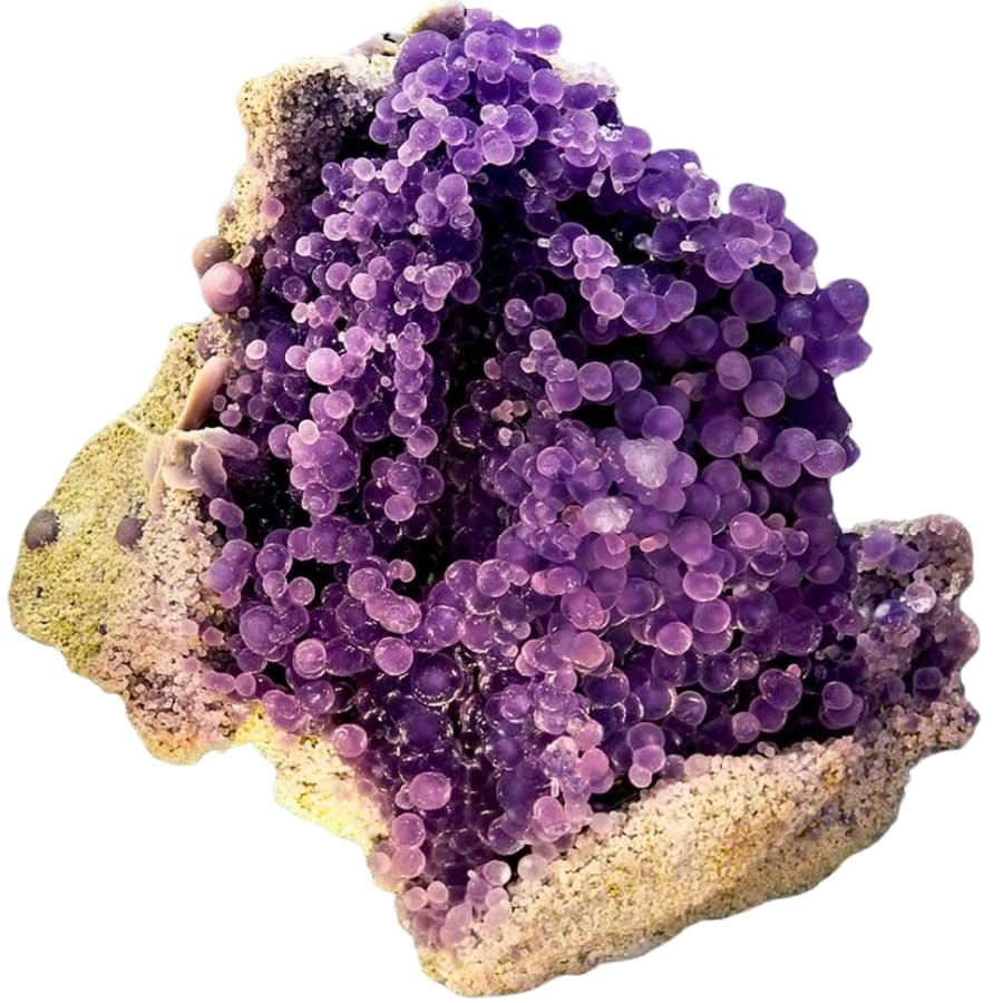 Round purple chalcedony crystals on matrix