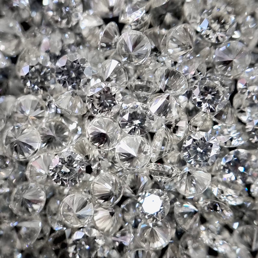 A cluster of polished brilliant round diamonds