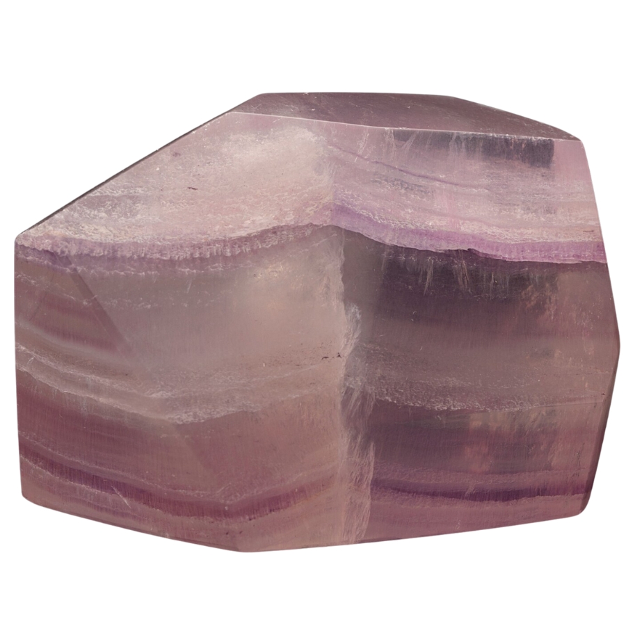 A gorgeous slab of a raw pink fluorite crystal with stripes of different pink hues