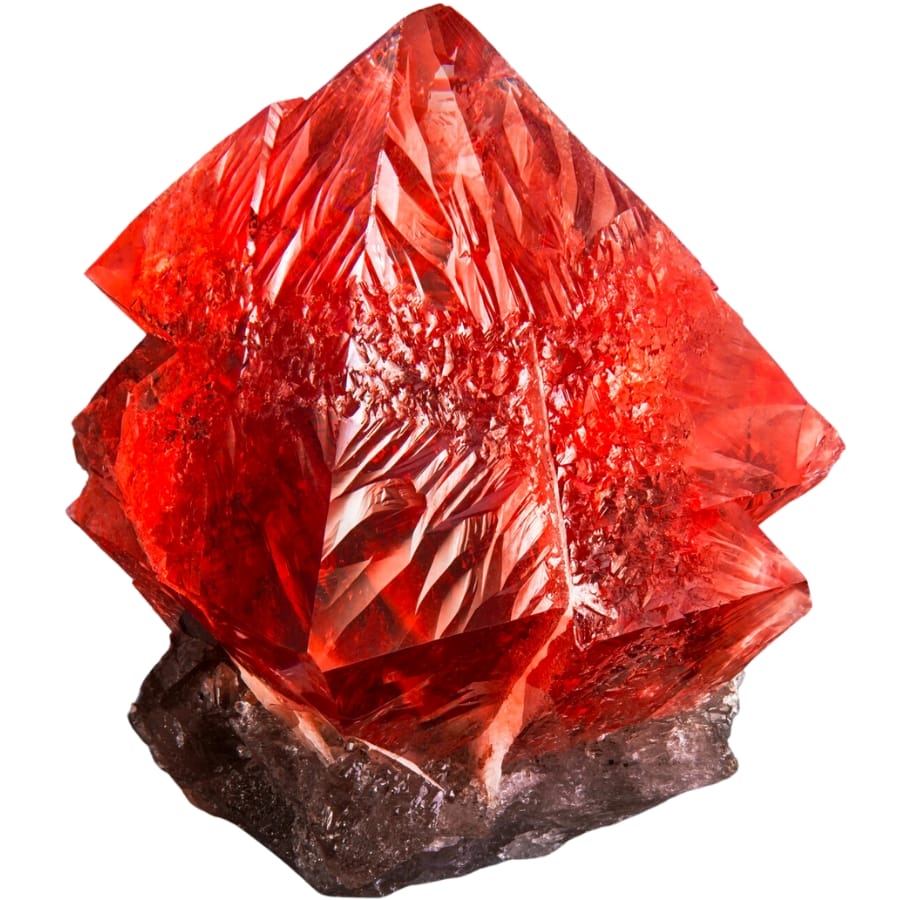 A deep saturated red fluorite on smoky quartz