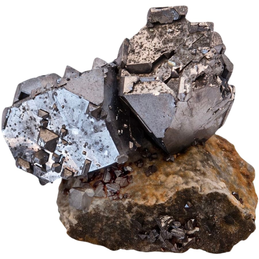 Two cubes of metallic gray galena on a rock matrix