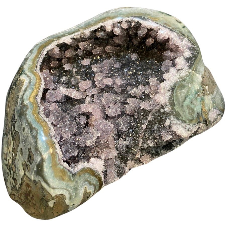 An open geode showing black galaxy amethyst crystals