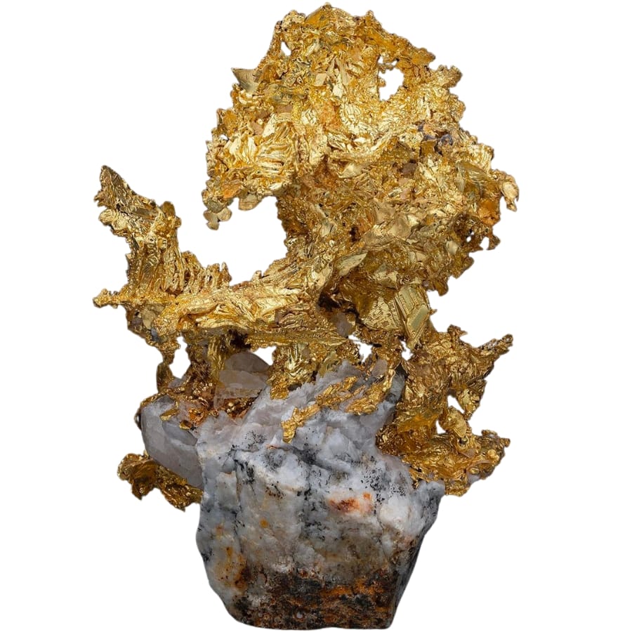 Intricately-shaped gold specimen atop a white quartz