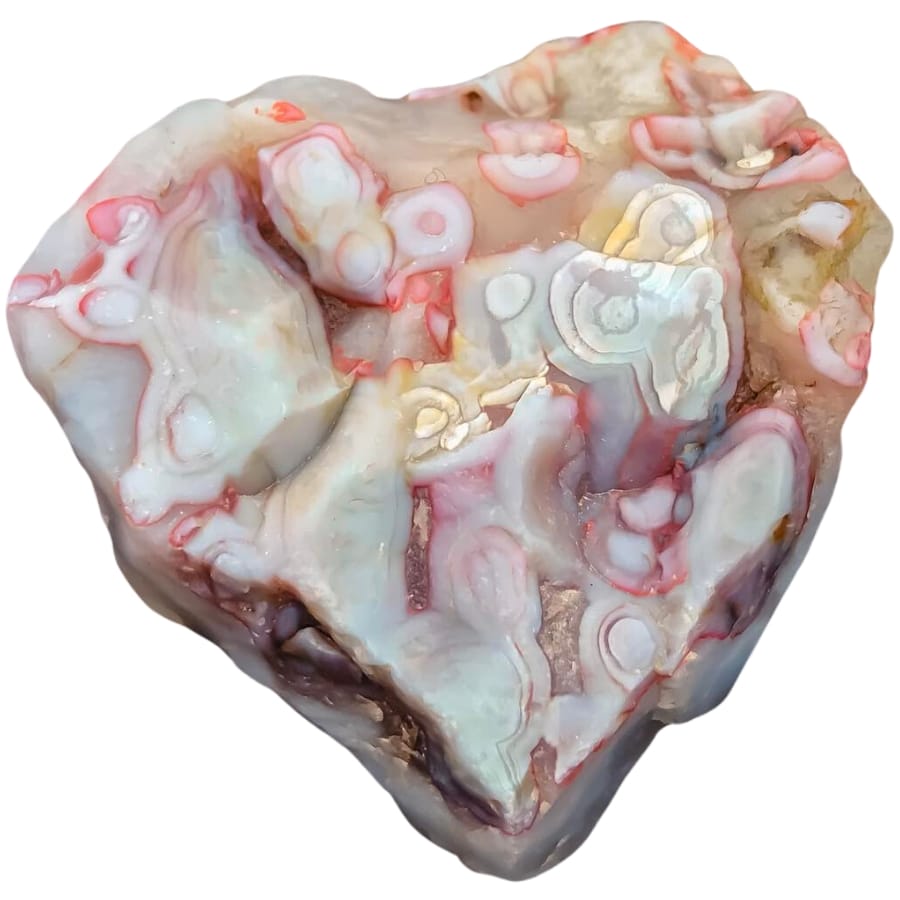 A raw white agate with patterns of light red and orange