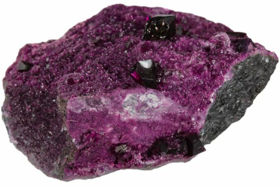A stunning deep purple kammererite on a bed of purple crystals