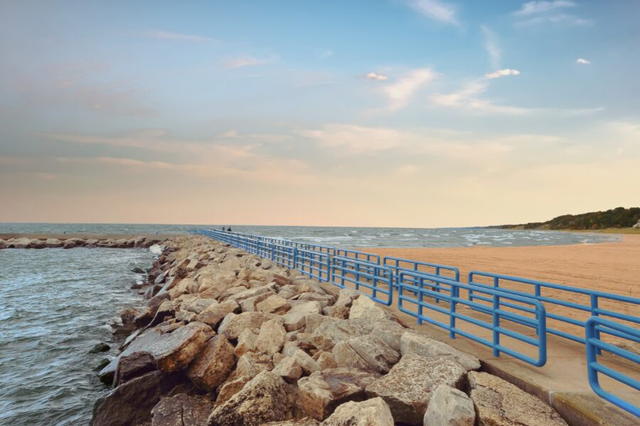 rocky pier with blue railings