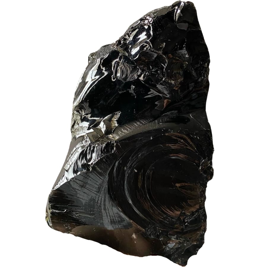 A shiny, raw black obsidian specimen