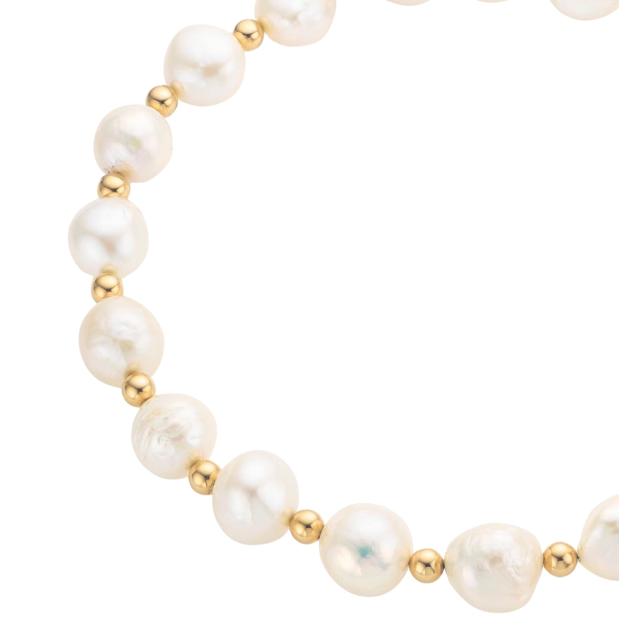 White pearls arranged in a bracelet with smaller golden beads
