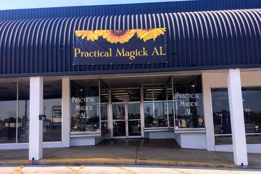 The building and front store window of Practical Magick AL