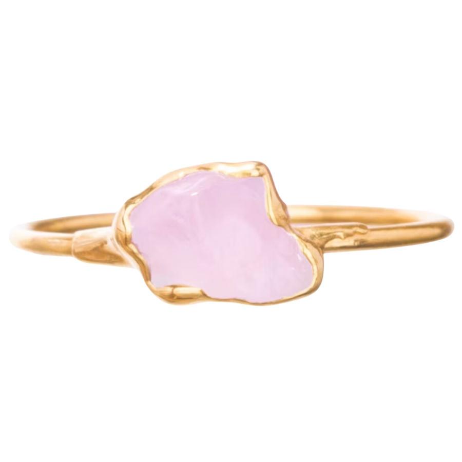 A cute and dainty rose quartz ring with gold lining and band