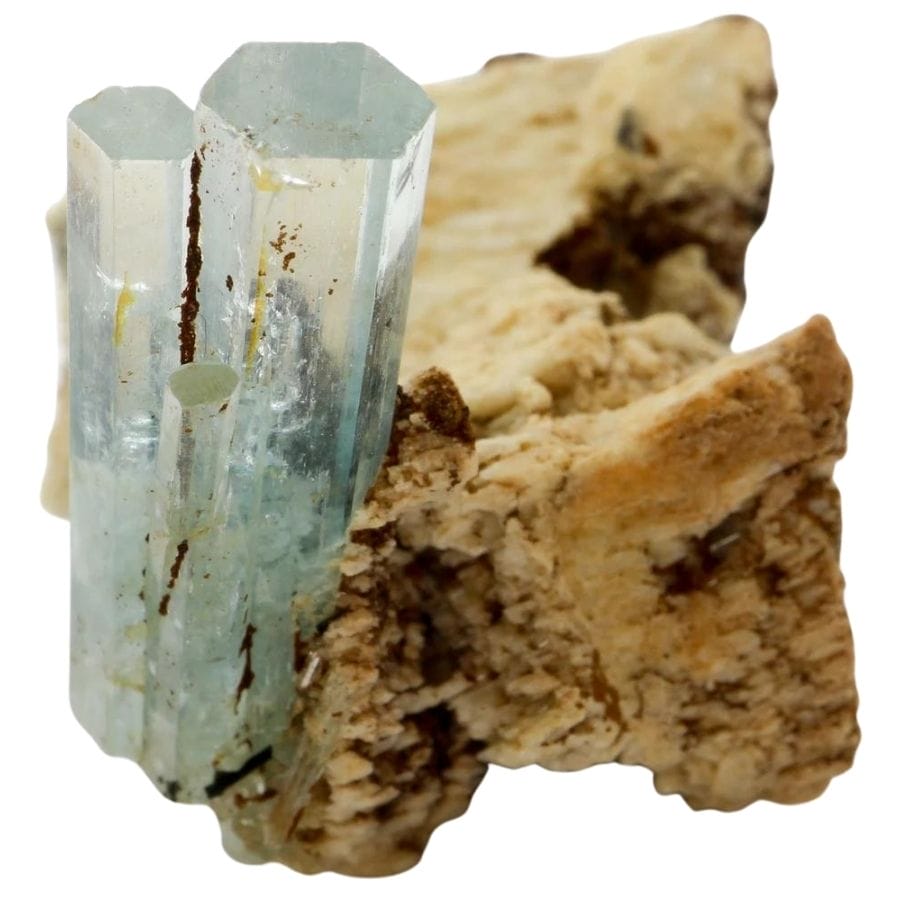 two transparent pale blue aquamarine crystals