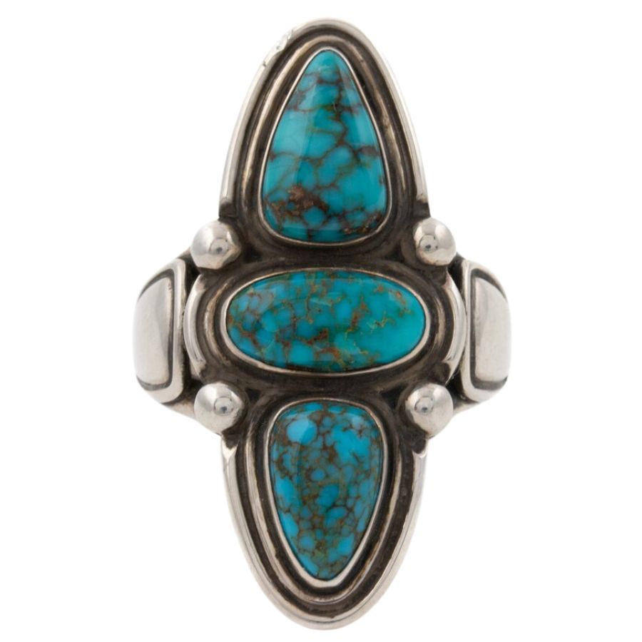 three Candelaria turquoise cabochons in a silver setting