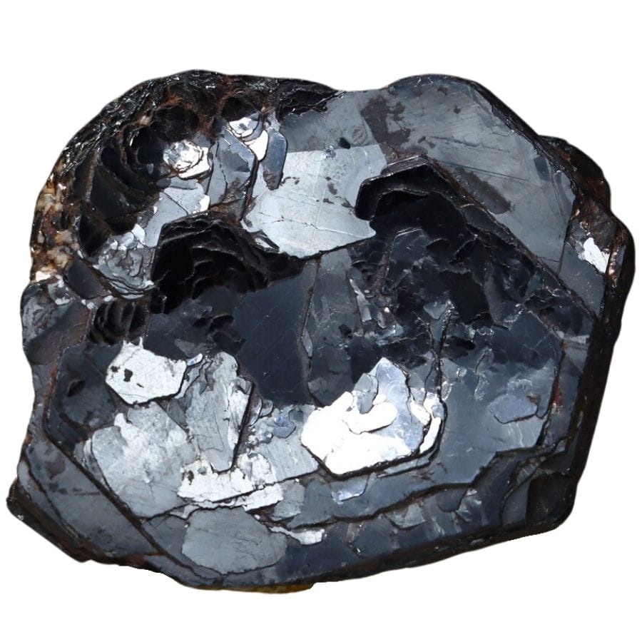 flat black hematite crystals on a rock