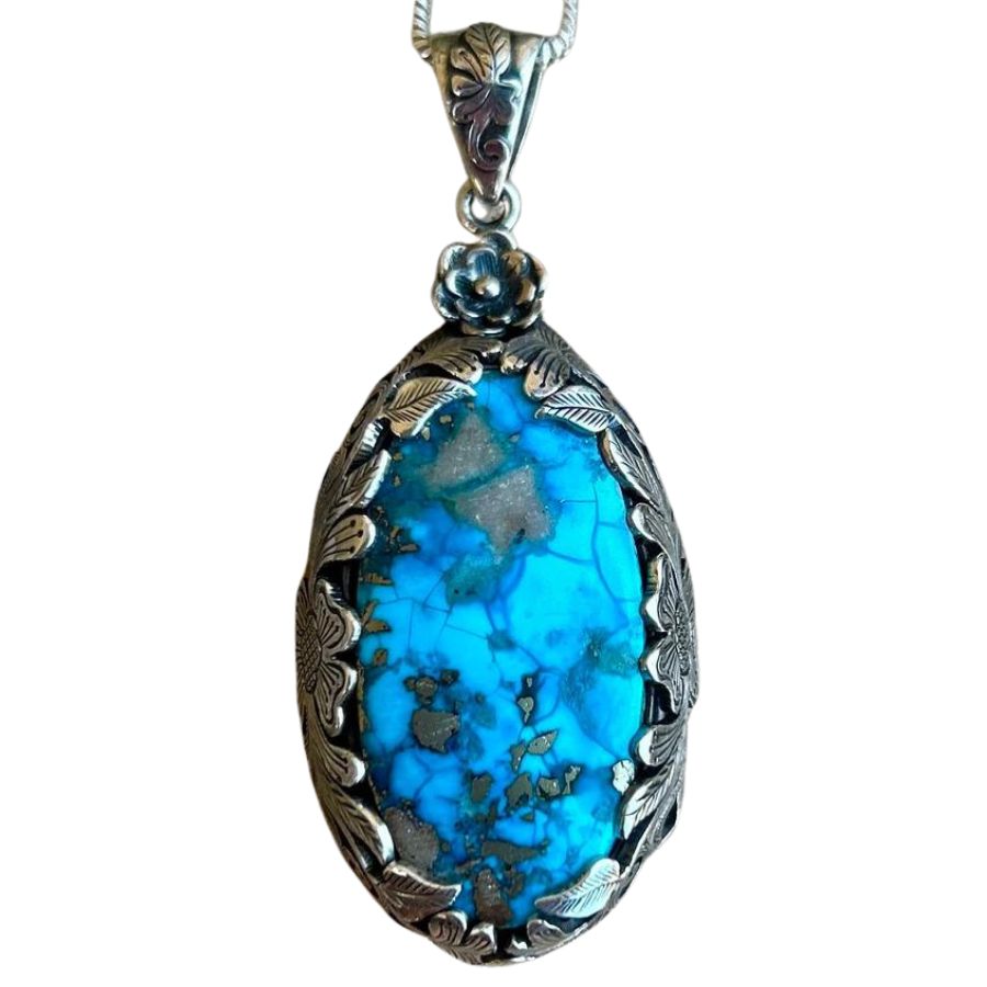 oval sky blue Persian turquoise pendant in a silver setting