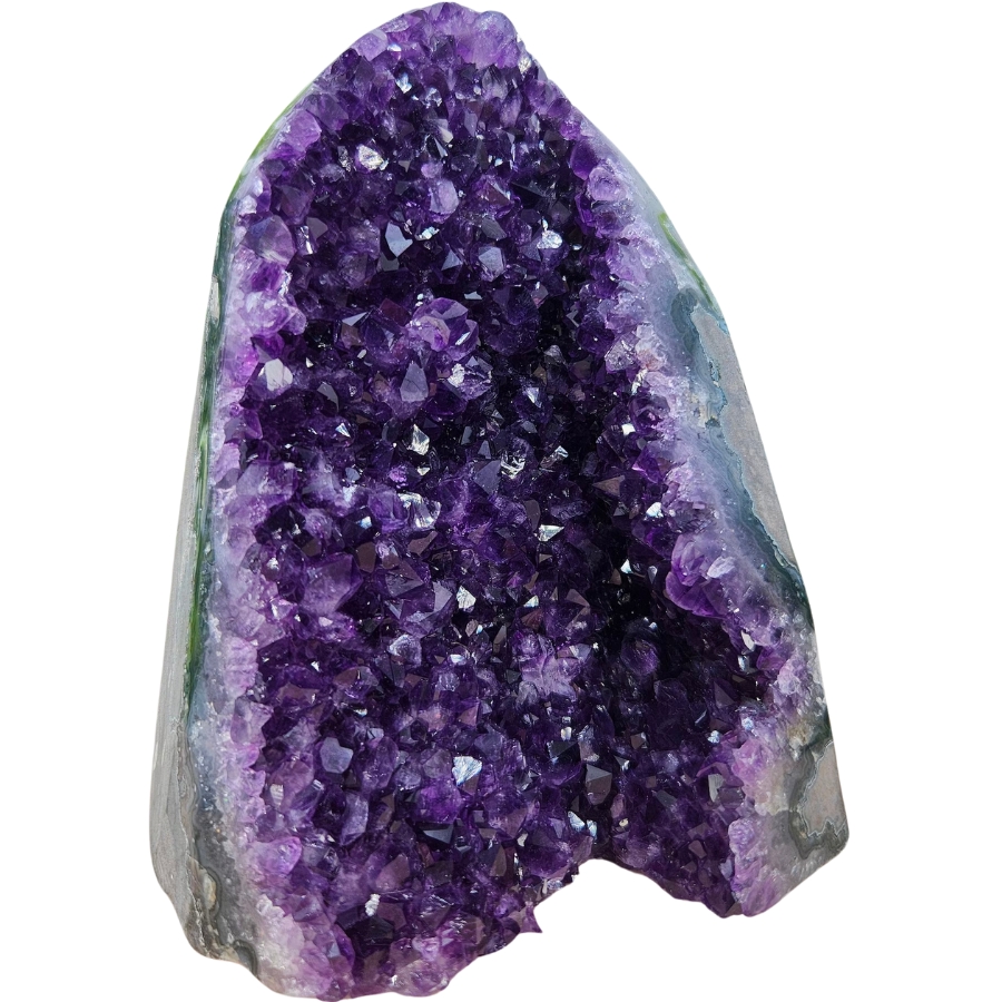 Vibrant, rich purple-colored amethyst crystals inside a geode