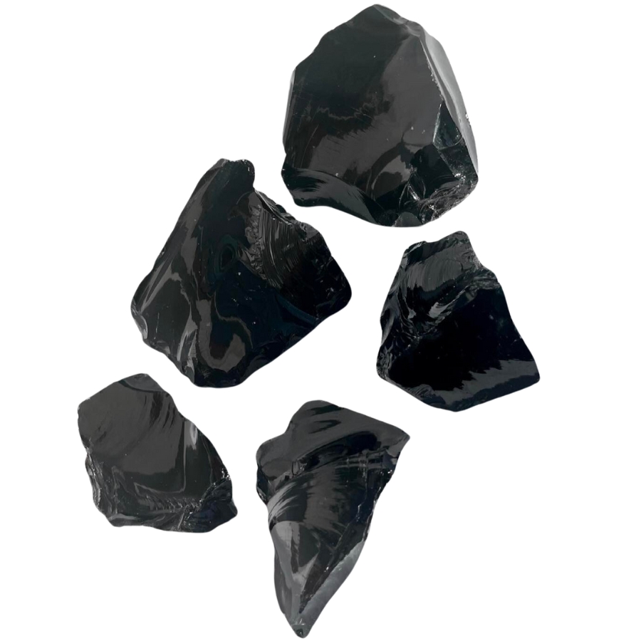 Pieces of raw, shiny, black obsidian