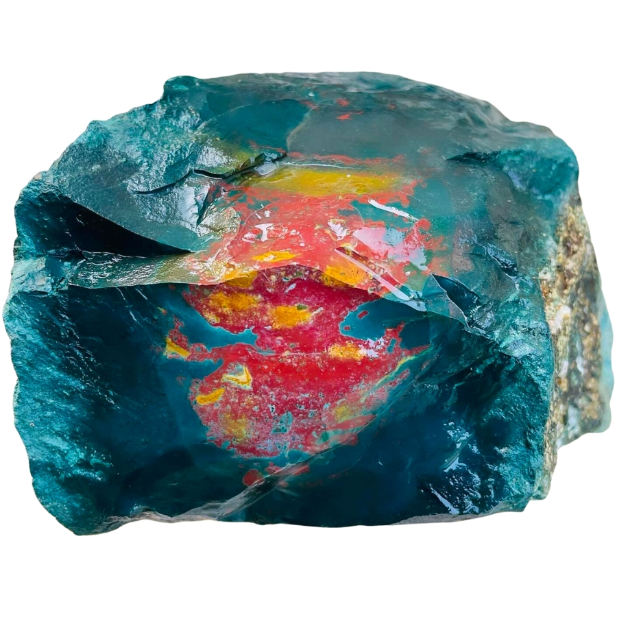 Raw bloodstone in deep blue green hue with blotches of red and yellow pattern in the middle