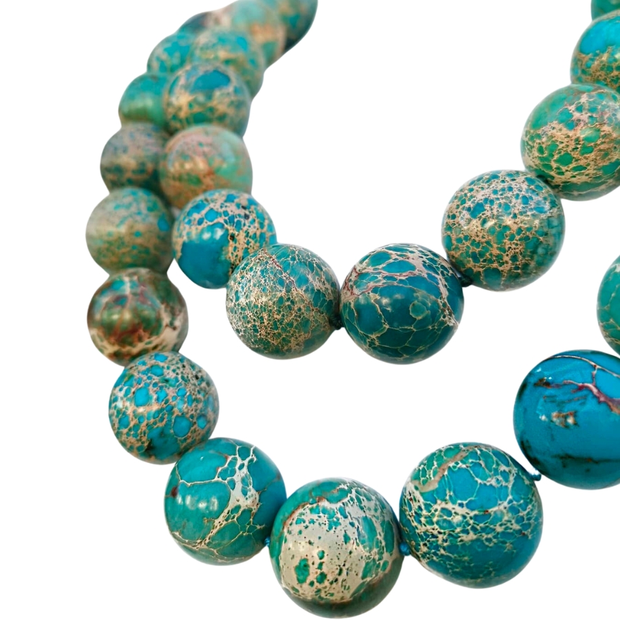 A necklace made out of blue jasper spheres