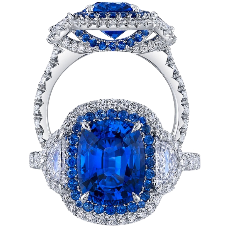 A diamond-cut blue sapphire set as center stone of a diamond-studded platinum ring