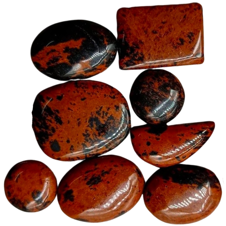 Differently-shaped tumbled mahogany obsidians dominantly brown in color