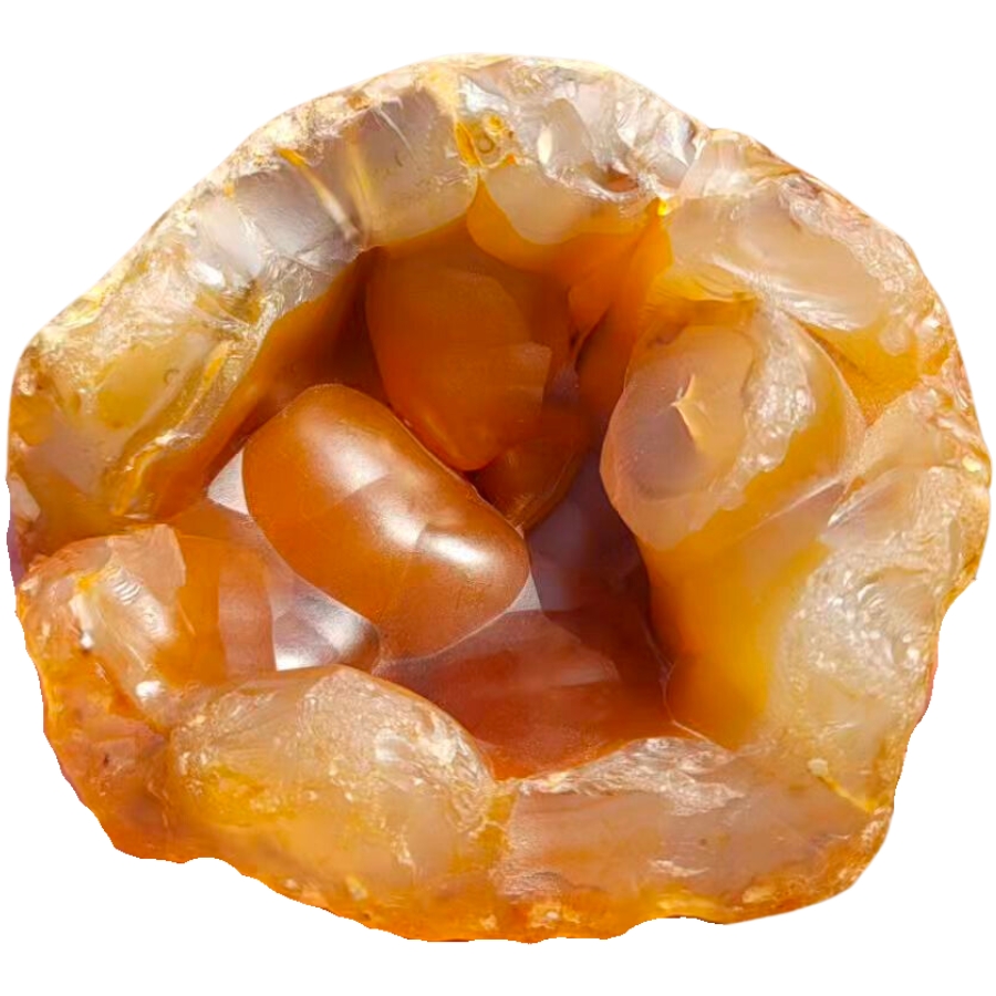 A stunning carnelian geode showing soft to rich orange colors