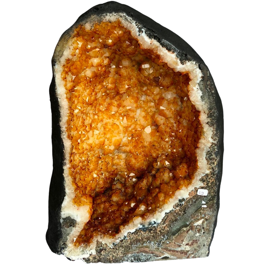 An enormous citrine geode with fine, orange to brown crystals
