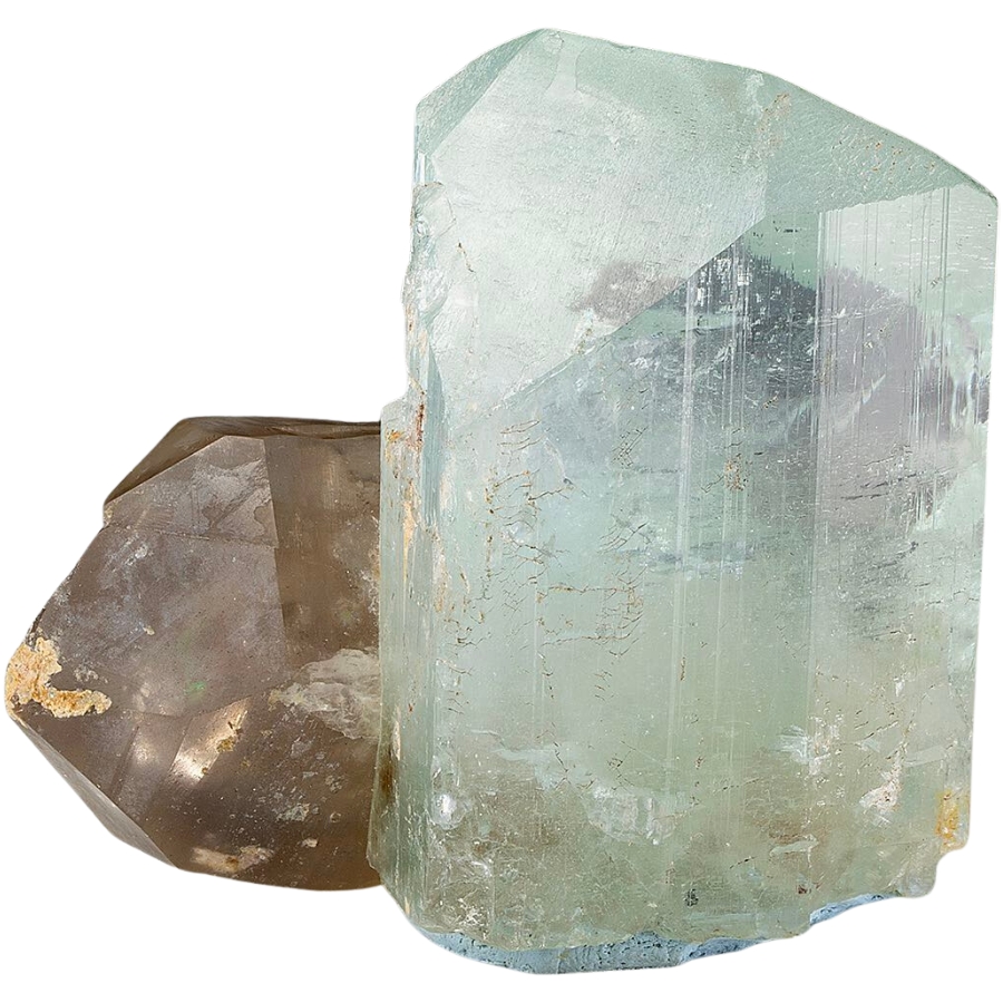 A soft blue topaz crystal with smoky quartz attached to one side
