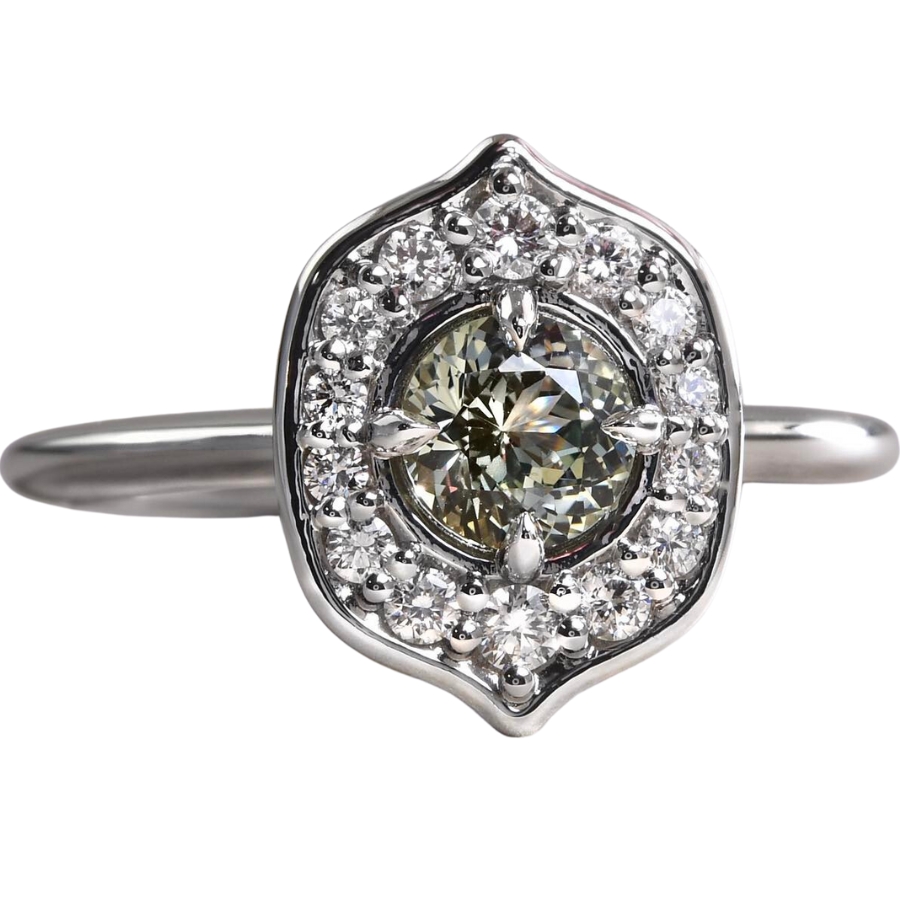 A beautiful, greenish-gray sapphire mounted on a ring