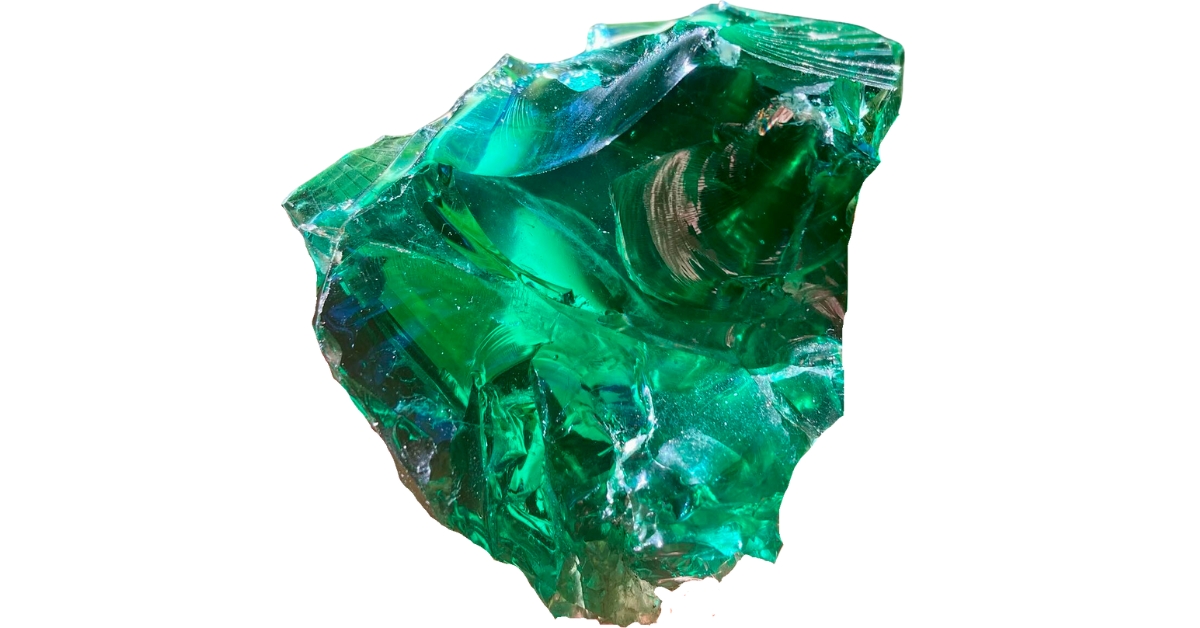 A raw piece of shiny, green obsidian