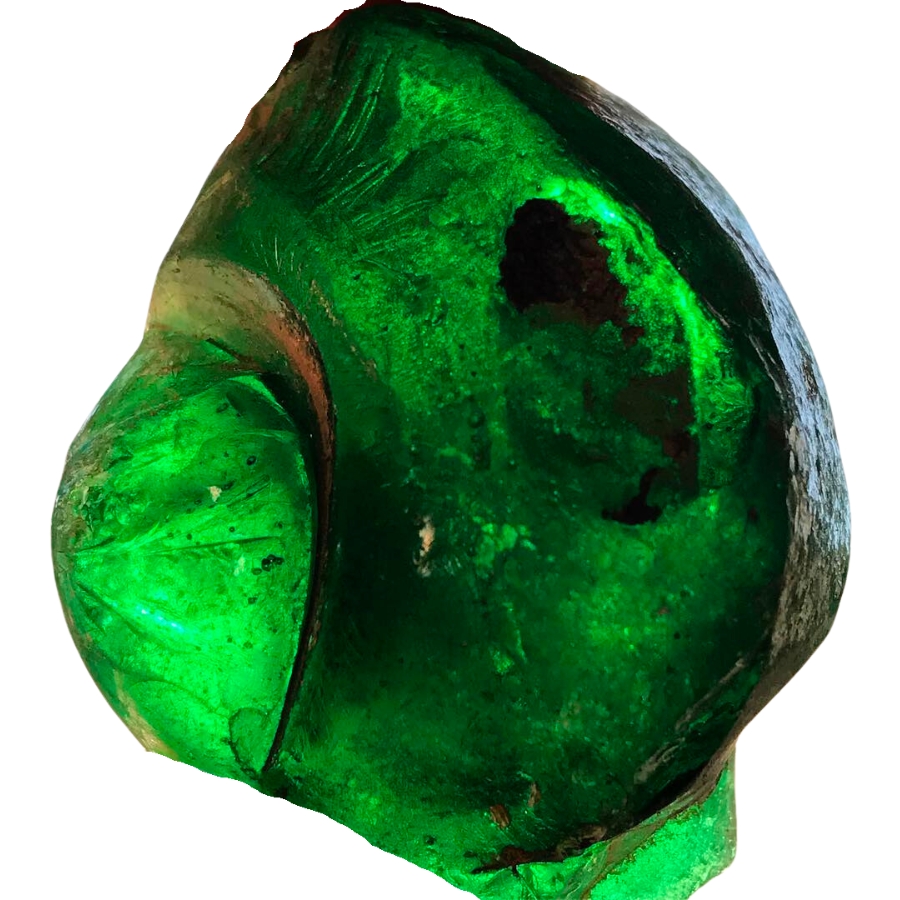 A piece of translucent, raw green obsidian