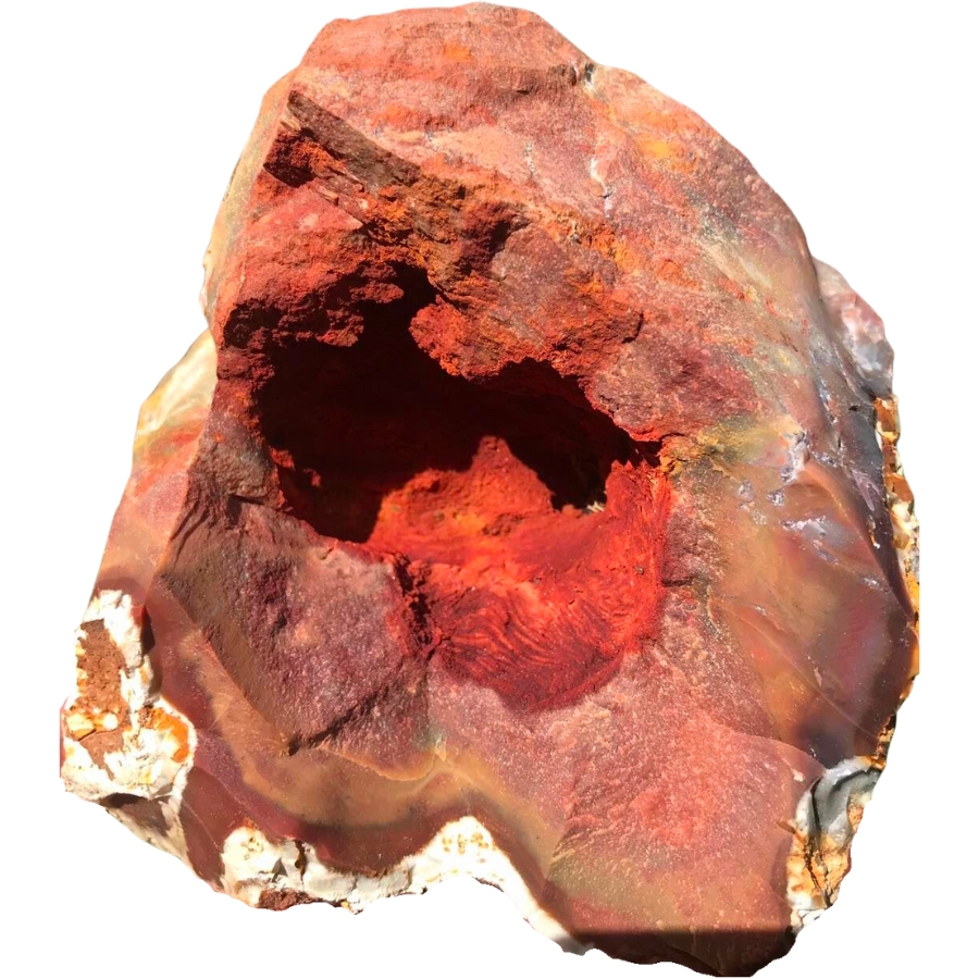 A cracked open jasper geode with rich orange red hues inside