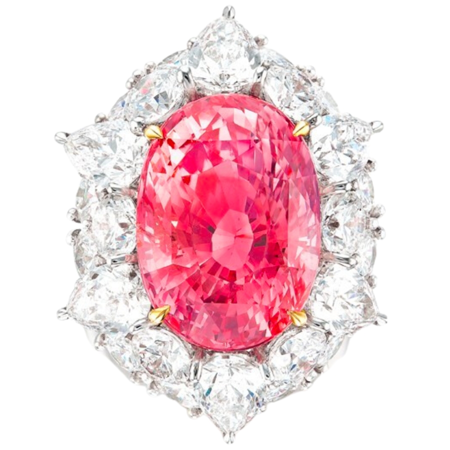 A big, beautiful pinkish-orange Padparadscha sapphire set on the middle of a brooch
