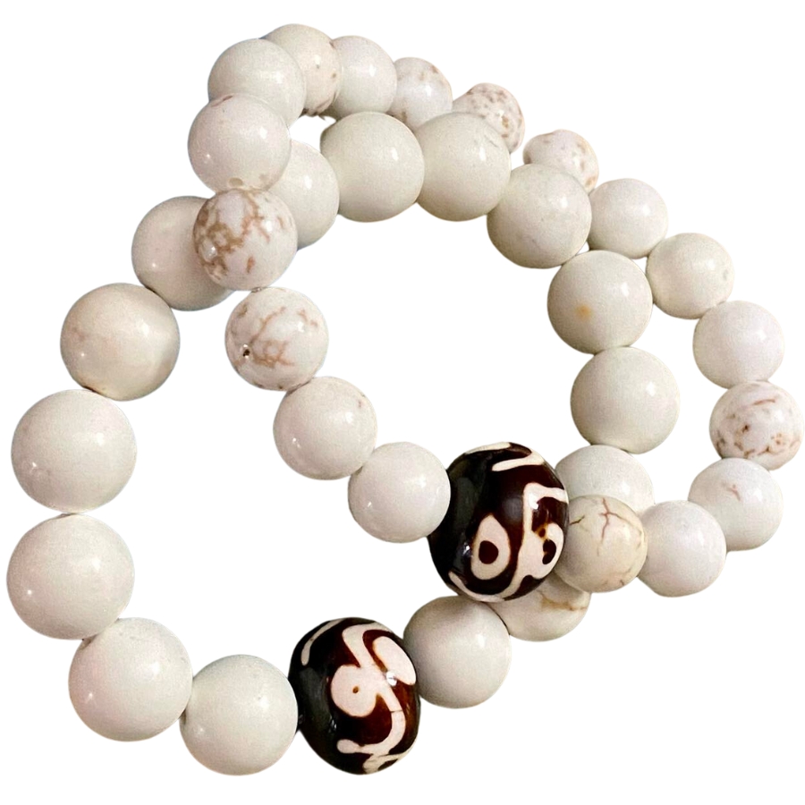 Two bracelets made out of white turquoise and white magnesite beads