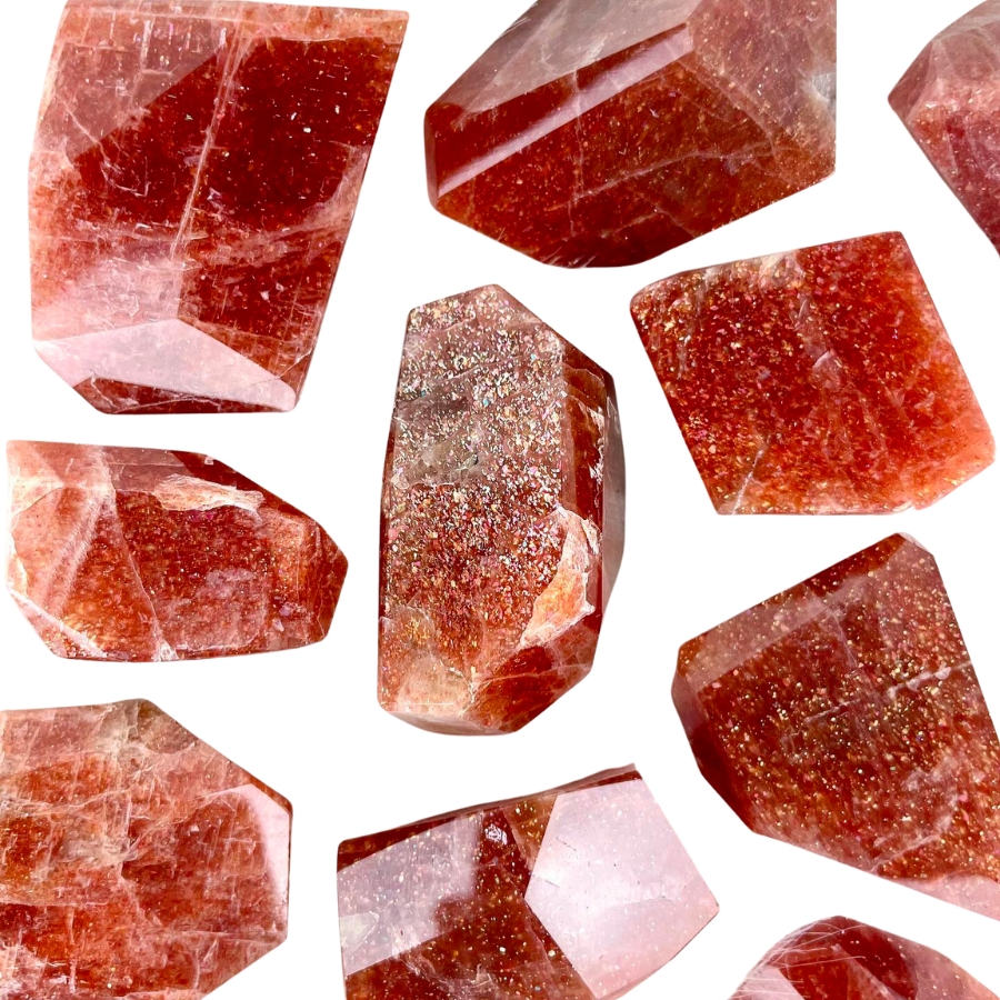 Several pieces of cut and polished sunstone displaying aventurescence