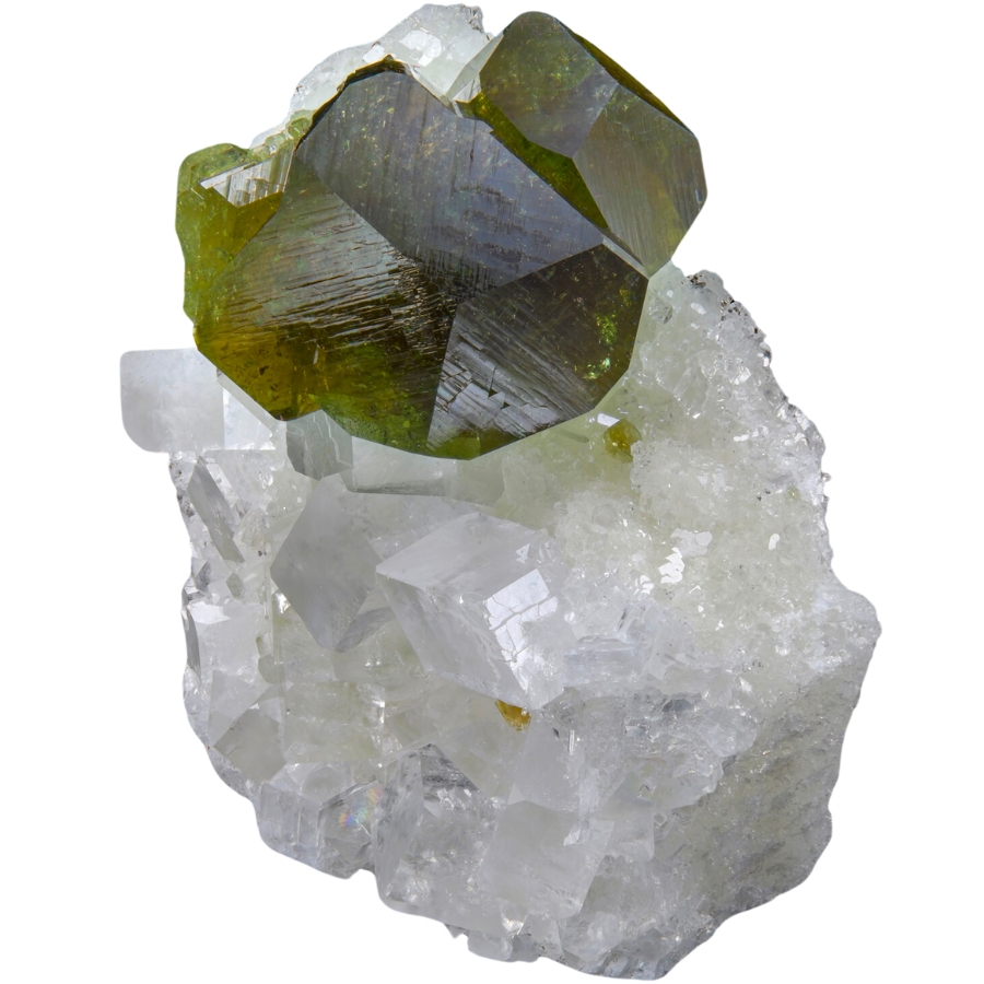 Dark green uvite crystals perched on white magnesite